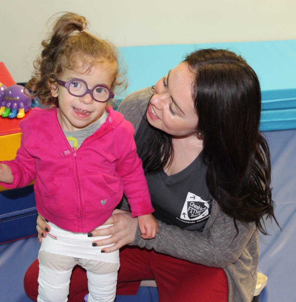 pediatric physical therapist working with child